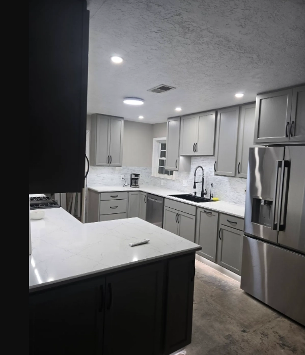 Gray shaker kitchen with marble backsplash in San Marcos