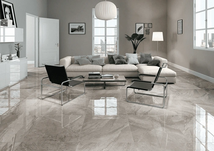 Luxurious polished marble floor in a modern living room with sectional sofa