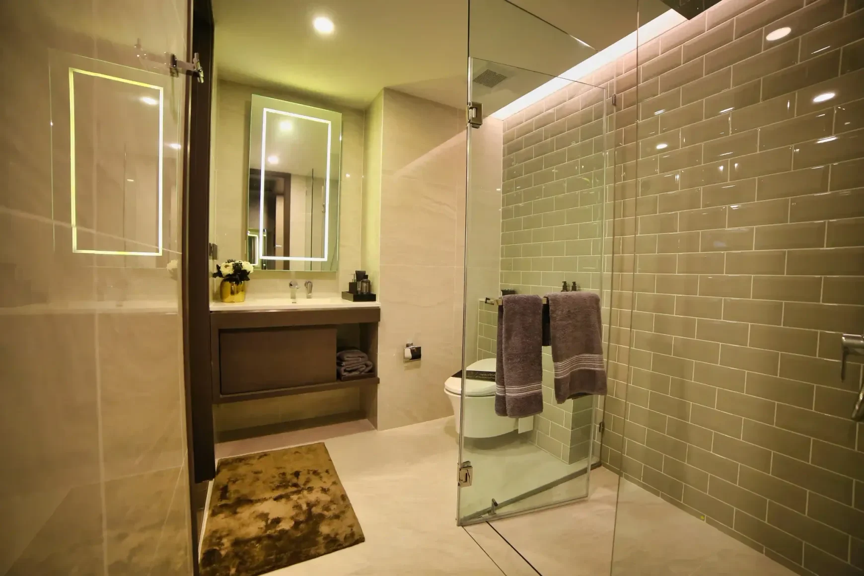 Sage green subway tile walk-in shower in a New Braunfels bathroom remodel